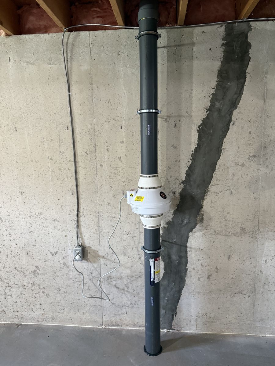 Radon system on a concrete basement wall