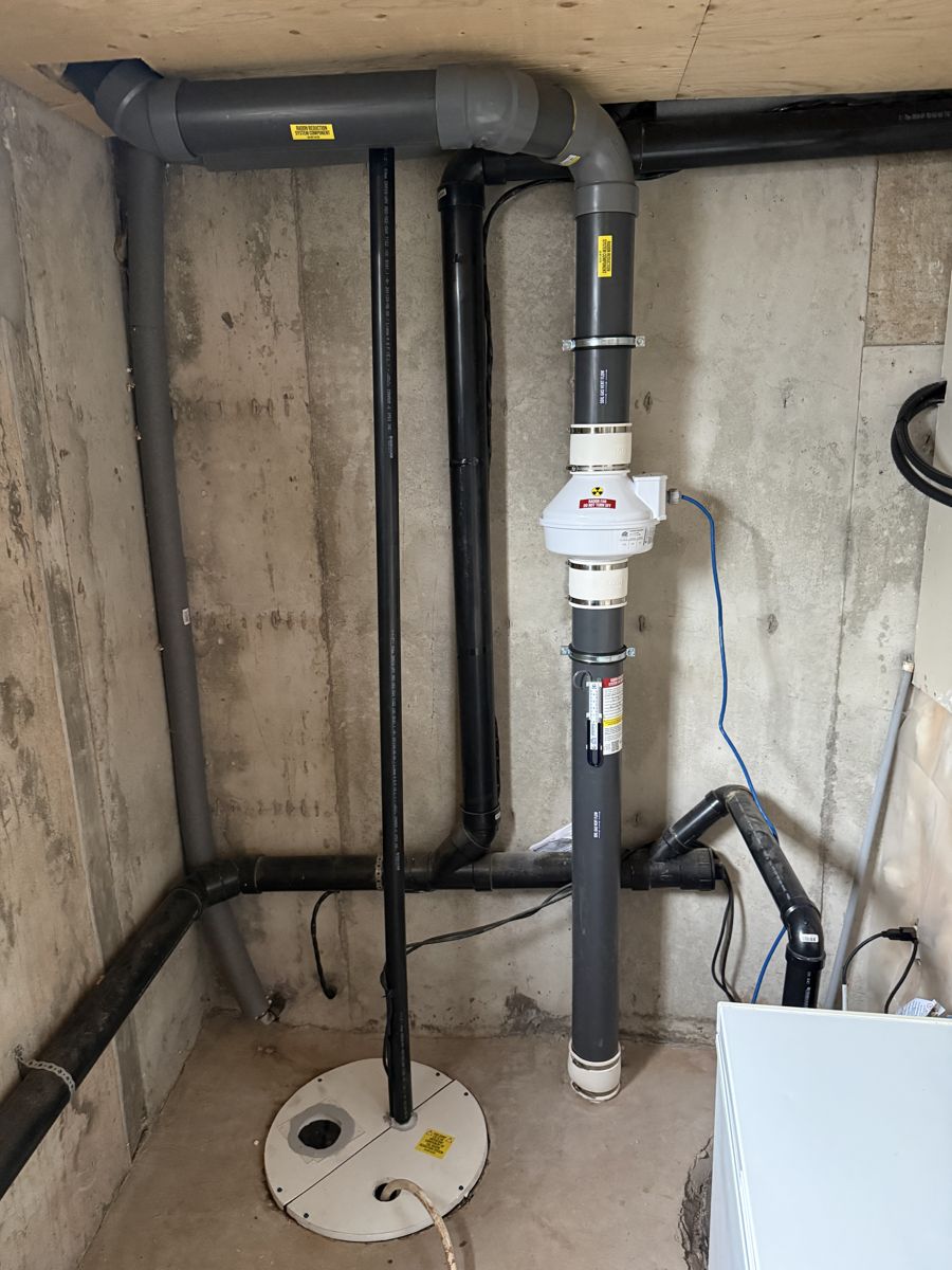 Radon system with a sealed sump pit