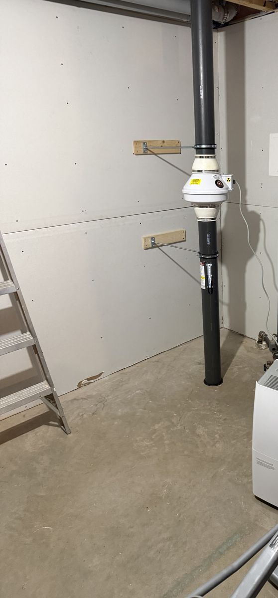 Radon fan installed in a utility room